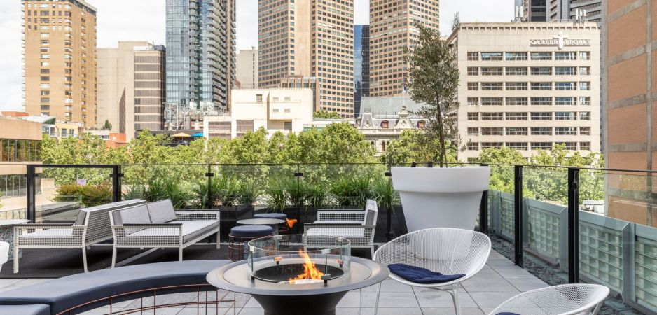 Luxury hotel rooftop with fireplace in Melbourne